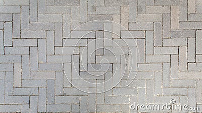 Road paved with sidewalk tiles. texture of light gray bricks Stock Photo