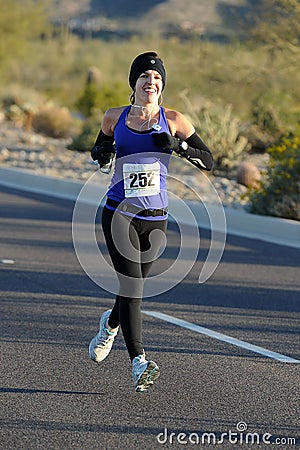 Road Race Female Runner. Editorial Stock Photo