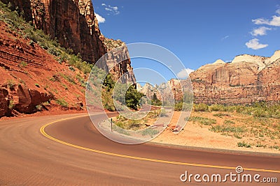 Road between red rocks, Zion National Park, Utah, USA Stock Photo