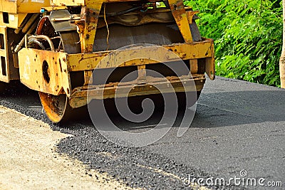 Road roller laying fresh asphalt Stock Photo