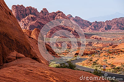 A road runs through it in the Valley of Fire State Park, Nevada, USA Stock Photo