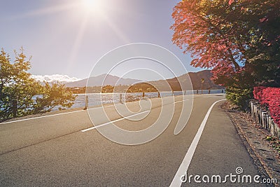 Road Scenery with Lake and Mountain Landscape Stock Photo