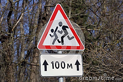 Road sign cautious children. Driver's warning about people running Stock Photo