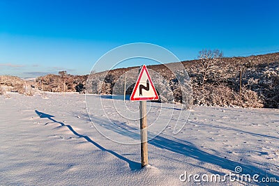 Road sign concept steep turn, close-up Stock Photo