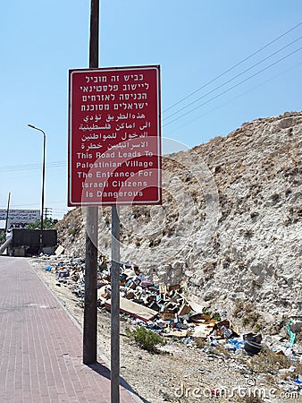Road with sign - Dangerous for Israelis Editorial Stock Photo
