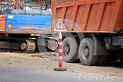 Road sign dangerous work on the background of construction or repair of a road in the city Stock Photo