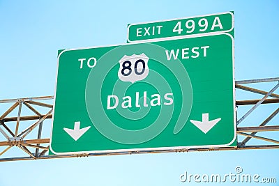 Road sign with the direction to Dallas Stock Photo
