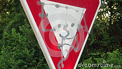 Road sign with spray painted ETA logo Editorial Stock Photo