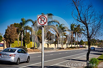 A road sign indicates no parking allowed Editorial Stock Photo