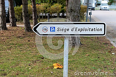 Road sign indicating Eurotunnel headquarters offices located in Coquelles. Editorial Stock Photo