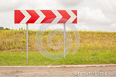 Road sign indicating a sharp right Stock Photo