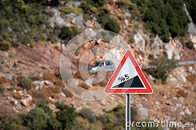 Road sign informing about steep rise on the mountain serpentine Stock Photo