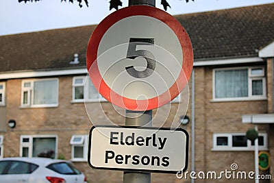 Road sign 5 mph Elderly Persons taken outside a care home UK Stock Photo