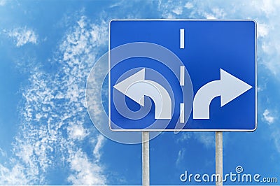 Road sign with opposite arrows on two rod and sky backgrounds Stock Photo