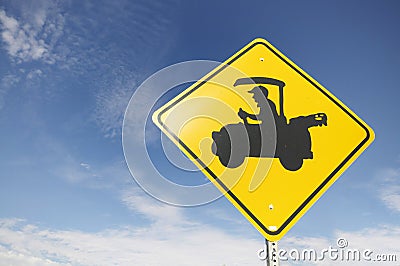 Road sign with senior driving golf cart. Stock Photo