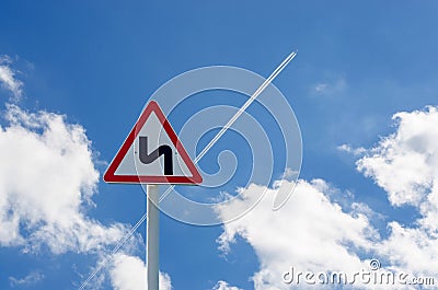 Road sign on sky background. The trace of the plane Stock Photo