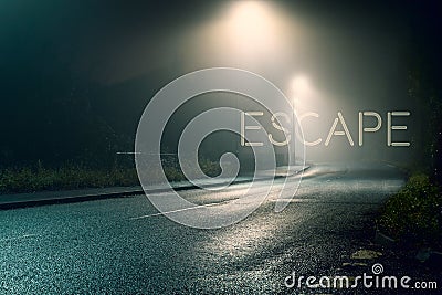 A road and street lights on a moody foggy winters night. With the word escape glowing above the road Stock Photo