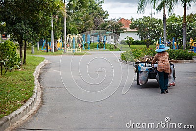 Road sweeper worker cleaning city street Editorial Stock Photo