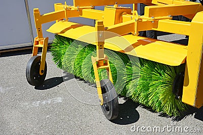 Road sweeper. Yellow street sweeper machine fow washing and cleaning asphalt road Stock Photo