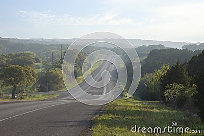 Road in the Texas Hill Country near sundown Stock Photo