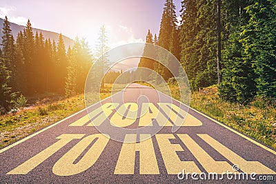 Road to hell written on the street in the mountains. Road to hell text on the highway Stock Photo