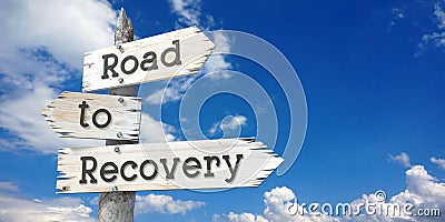 Road to recovery - wooden signpost with three arrows Stock Photo