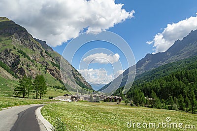 Road to a small alpine village Stock Photo