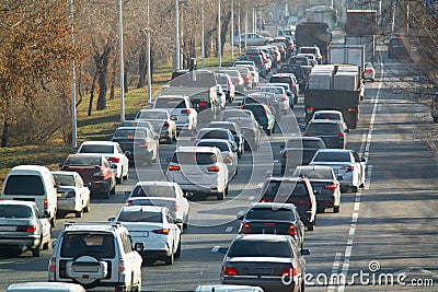 Road traffic congestion. Many different cars are stuck in a traffic jam in a city street. Diagonal view Stock Photo