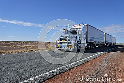 Road train driving in central Australia Outback Editorial Stock Photo