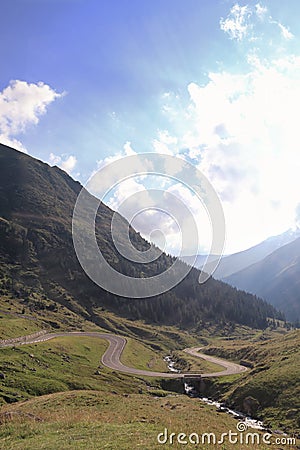 Road on the transfagarastan route in Romania. There are monutains around it Stock Photo