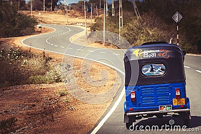 Road traveling. Tuk-tuk auto rickshaw. Bajay or Bajaj Editorial Stock Photo