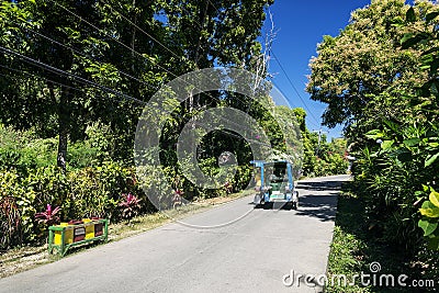 Road and tuk tuk moto taxi on tropical boracay philippines Editorial Stock Photo