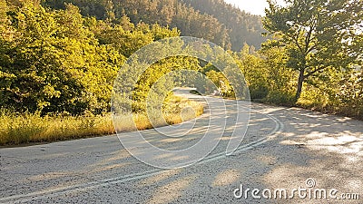 Road turns in the forest in spring season from Ioannina city to Vrosina village Greece Stock Photo