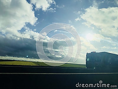 Road view with road, asphalt, clouds, and truck in France Europe Stock Photo