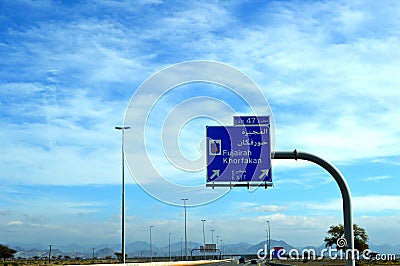 Road view in Sharjah Kalba road with Road Direction Sign Board Editorial Stock Photo