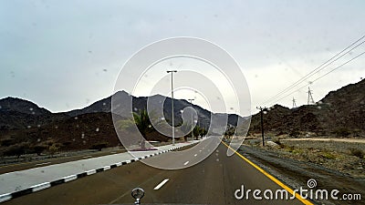 Road view in Sharjah Kalba road with Road Direction Sign Board Editorial Stock Photo
