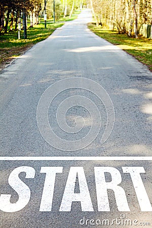 Road with white start sign Stock Photo