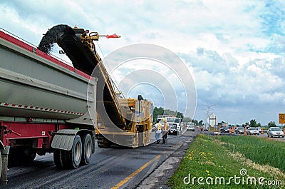 Road work with an asphalt road milling machine Editorial Stock Photo