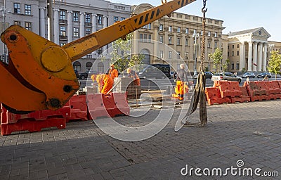 Road work, laying paving slabs on Independence Avenue Editorial Stock Photo