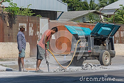 Road workers breaking street Editorial Stock Photo