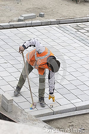 Road workers repair the sidewalk in Istanbul near the Galata Bridge Editorial Stock Photo