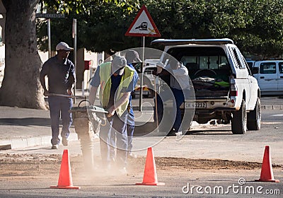 Workmen using an earth compactor in South Africa Editorial Stock Photo