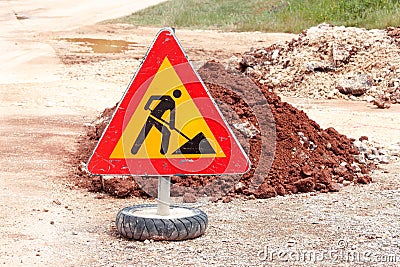 Road works sign for construction works, road, pavement construction. Traffic, warning sign road repairing, road maintenance. Stock Photo