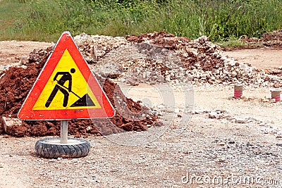 Road works sign for construction works, road, pavement construction. Traffic, warning sign road repairing, road maintenance. Stock Photo