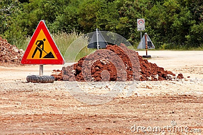 Road works sign for construction works, road, pavement construction. Traffic, warning sign road repairing, road maintenance. Stock Photo