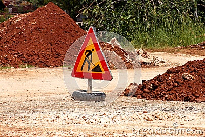 Road works sign for construction works, road, pavement construction. Traffic, warning sign road repairing, road maintenance. Stock Photo