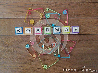 Roadmap in letters on wood background with colorful geometric shapes Stock Photo