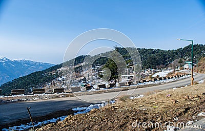 Roads covered by snow between mountains of Patnitop and nathatop Jammu Stock Photo