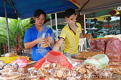 Roadside stall selling maltose candy biscuit at Tualang in Malay Editorial Stock Photo