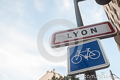 Roadsign indicating the entrance to Lyon with a bicycle sign. This sign is a standard French plate visible at every city entrance Editorial Stock Photo